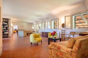 a living room with a couch and chairs and a table at Agriturismo Lemene in Caorle