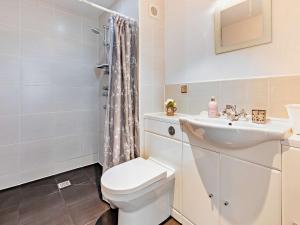 a bathroom with a toilet and a sink at 6 bed in Buckland Brewer 75553 in Buckland Brewer +58 photos