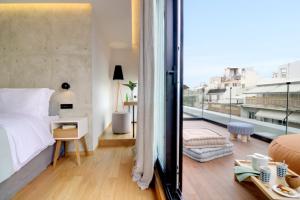 מיטה או מיטות בחדר ב-Coco-Mat Hotel Athens