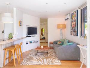 a living room with a couch and a table at Le Lodge SXM luxe in Cul de Sac +14 photos