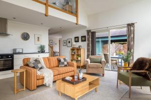 a living room with a couch and chairs and a table at Little Pitnacree in Pitlochry
