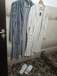a group of clothes hanging on a rack at Seven Studio in Saturn +3 photos
