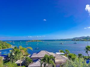 a view of a bay with boats in the water at Le Lodge SXM luxe in Cul de Sac