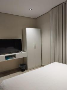 Katil atau katil-katil dalam bilik di Living Room Qiblatain