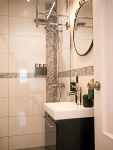 a bathroom with a sink and a shower at El Pirata 78 in Estepona +60 photos