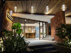 a lobby of a building with wooden ceilings at 205MSNK Spacious Studio l Window & Kitchen in Can Tho