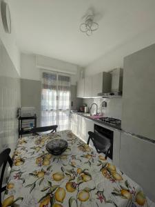 a kitchen with a table with a plate on it at Casa Luna in Mandello del Lario
