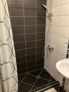 a bathroom with a shower and a sink at Borovets Gardens apartment C-43 in Borovets +20 photos