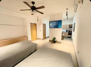 Ένα ή περισσότερα κρεβάτια σε δωμάτιο στο Departamento con terraza y asador