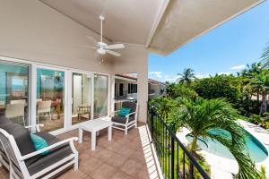 a balcony with a view of the beach and the ocean at Beautiful 3 Bedroom Condo With Ocean Views in Tamarindo