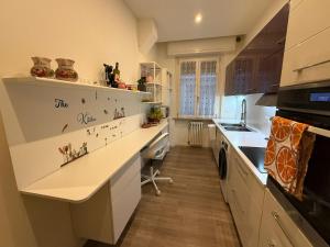 a kitchen with a white counter top and a sink at da angela in Montelabbate