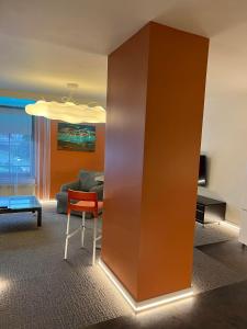 a living room with a couch and a chair at Apartament Baszta 7 Płaszczy, Panieńska in Szczecin