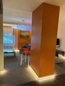 a living room with a couch and a chair at Apartament Baszta 7 Płaszczy, Panieńska in Szczecin