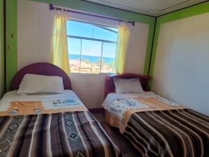 Postel nebo postele na pokoji v ubytování Kantuta T'ika Lodge