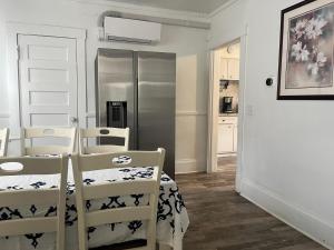 a kitchen with two chairs and a white door at Home In Highland Park in Saint Paul +19 photos