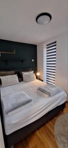 Ένα ή περισσότερα κρεβάτια σε δωμάτιο στο Vista apartman