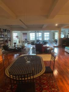a large living room with a table and chairs at Room in a Luxury Loft near Jean-Talon Market in Montréal