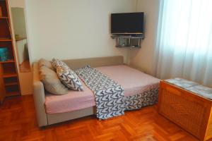 Postel nebo postele na pokoji v ubytování Nomada Apartment