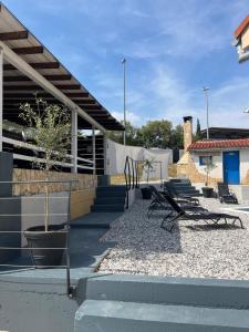 a group of chairs sitting on the side of a building at Manolo house with jacuzzi & pool in Pula