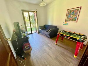 a living room with a lego table in the middle of a room at Villa Silvana Quiet Escape in Bolsena