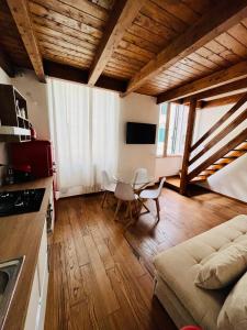 a living room with a couch and a table at Casa Claretta in Livorno +30 photos