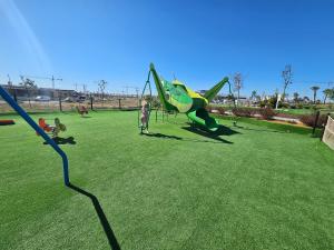 a group of children playing in a park with an airplane at Casa Soluna -Santa Rosalia Lake and Life Resort in Torre-Pacheco
