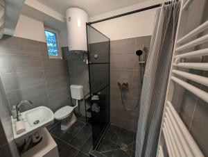 Koupelna v ubytování Flataid Apartment Prankergasse direkt beim Bahnhof + 2 fotografie