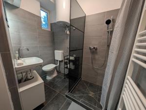 Koupelna v ubytování Flataid Apartment Prankergasse direkt beim Bahnhof