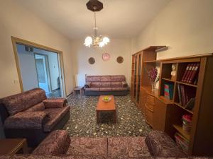 a living room with a couch and a table at Kiourtis House in Elevtheraí