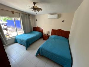 Ένα ή περισσότερα κρεβάτια σε δωμάτιο στο Family home with private pool, Casa Palapa +19 φωτογραφίες