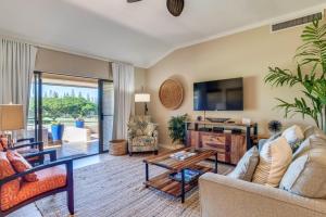 a living room filled with furniture and a flat screen tv at Kapalua Golf Villas 15P3-4 in Kapalua