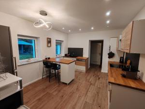 a kitchen with a table and a counter top at Julia in Schiffweiler