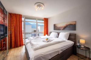 Postel nebo postele na pokoji v ubytování Divina Minusio - Happy Rentals