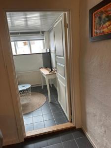 a small room with a desk and a window at Kilimanjaro & Stayover in Svinninge