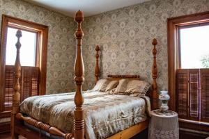 Ένα ή περισσότερα κρεβάτια σε δωμάτιο στο Hotel Manning