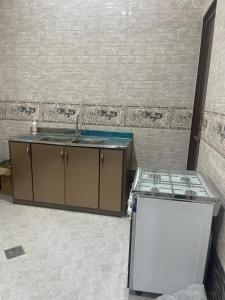 an unfinished kitchen with a sink and a counter at شقه دخول ذكي ومدخل سياره in Hail