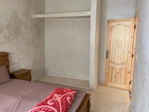 En eller flere senge i et værelse på shtotl appartement taghazout