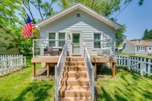 a tiny house with a staircase in a yard at Como Cottage - Stay for 6 in Lake Geneva
