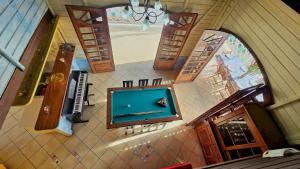 an overhead view of a pool table in a room at VILLA La Suite Viva Vero in Les Trois-Îlets +37 photos