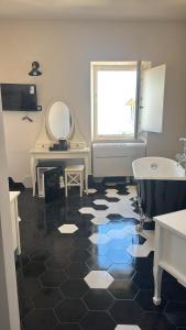a bathroom with a sink and a tub and a mirror at DeD Palace Tivoli in Tivoli +27 photos