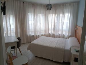 Posteľ alebo postele v izbe v ubytovaní Hostal Quiper + 28 fotografií