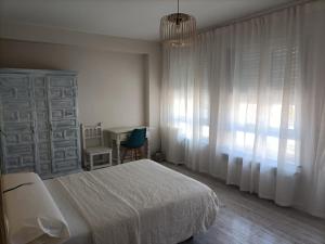Posteľ alebo postele v izbe v ubytovaní Hostal Quiper
