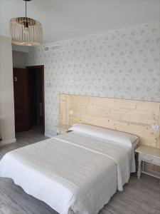 Posteľ alebo postele v izbe v ubytovaní Hostal Quiper