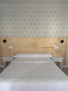 Posteľ alebo postele v izbe v ubytovaní Hostal Quiper