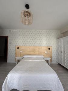 Posteľ alebo postele v izbe v ubytovaní Hostal Quiper