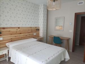 Posteľ alebo postele v izbe v ubytovaní Hostal Quiper