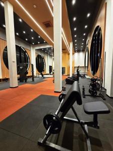 a gym with several treadmills and machines in it at Studio 705 Premium no Centro de Chapecó com Varanda Piscina Academia e Vaga Garagem AP Completo in Chapecó