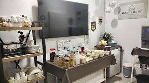 a kitchen with a table with food on it at Ozzy Lodge Semporna in Semporna