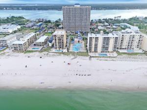 an aerial view of a beach and buildings at Sunset Crossing in Gulf Shores
