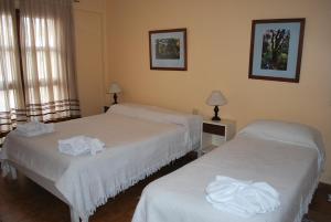 Ένα ή περισσότερα κρεβάτια σε δωμάτιο στο Apart Hotel El Portico +78 φωτογραφίες